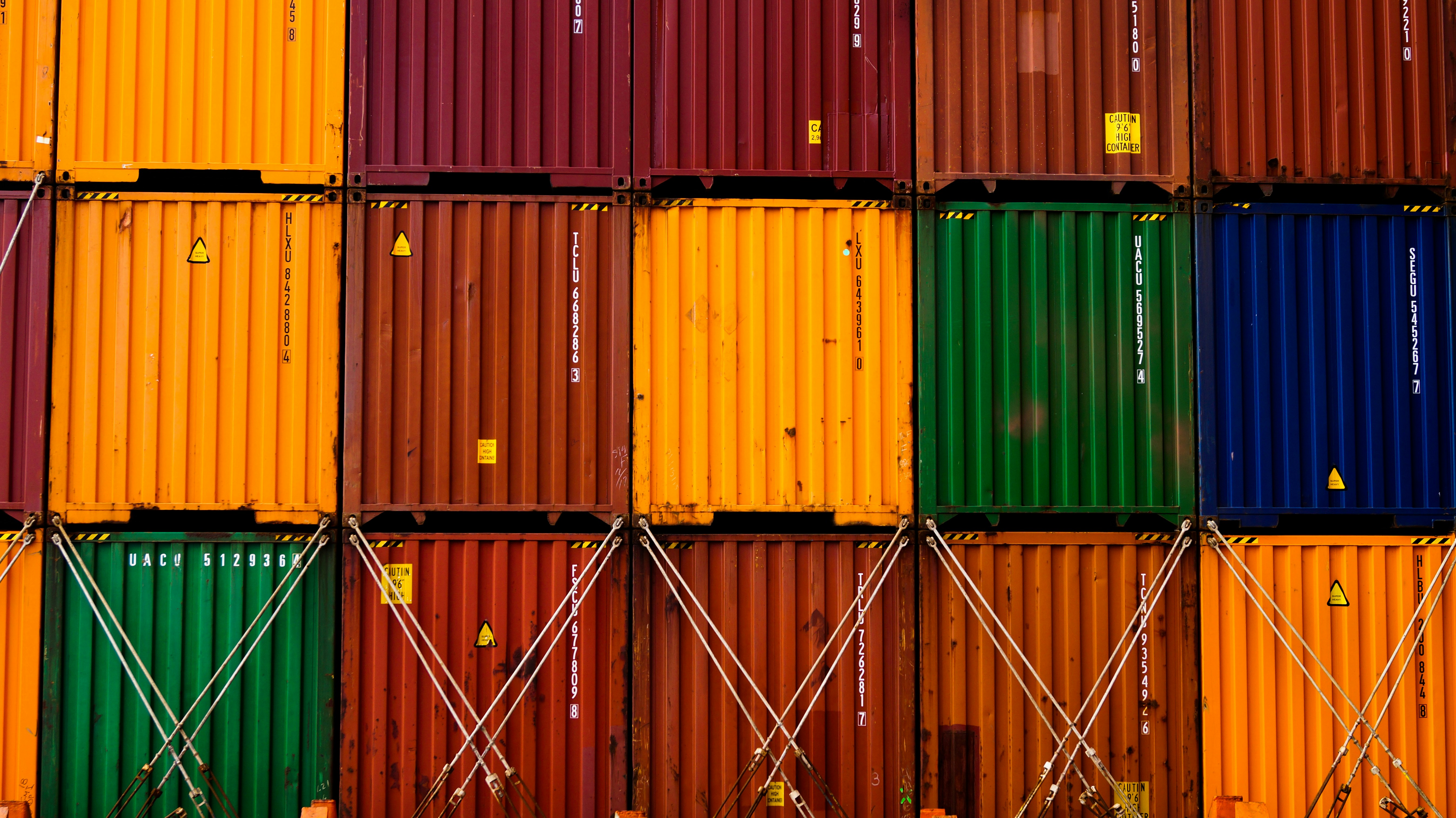 stack of red green and yellow wooden crates